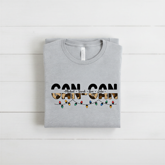 A gray t-shirt with the text "CAN CAN" printed on it, along with a graphic of colorful lights.