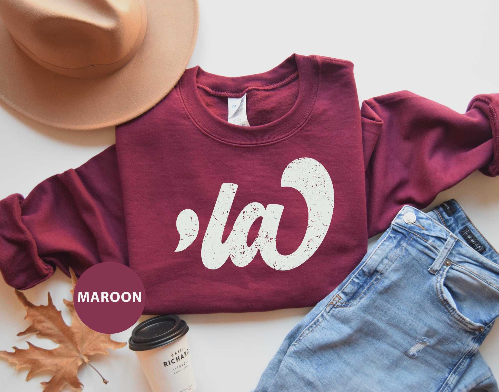 a maroon sweatshirt with the word ca on it