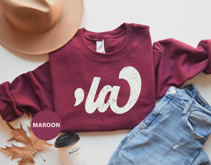 a maroon sweatshirt with the word ca on it