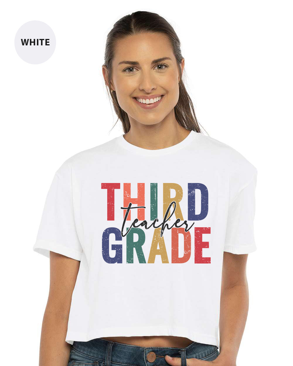 a woman wearing a white shirt that says third grade