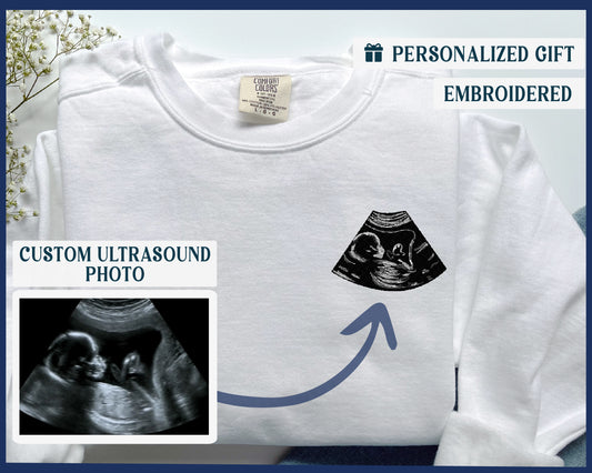 a t - shirt with a picture of a baby in a diaper