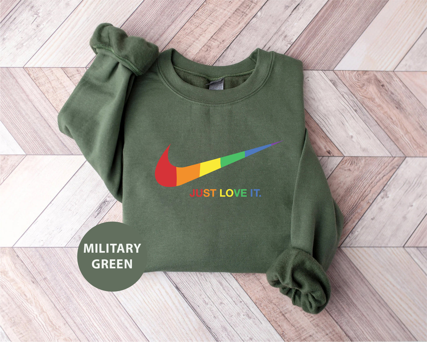 a green sweatshirt with a rainbow nike logo on it