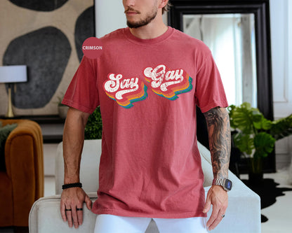 a man in a red shirt standing in a living room