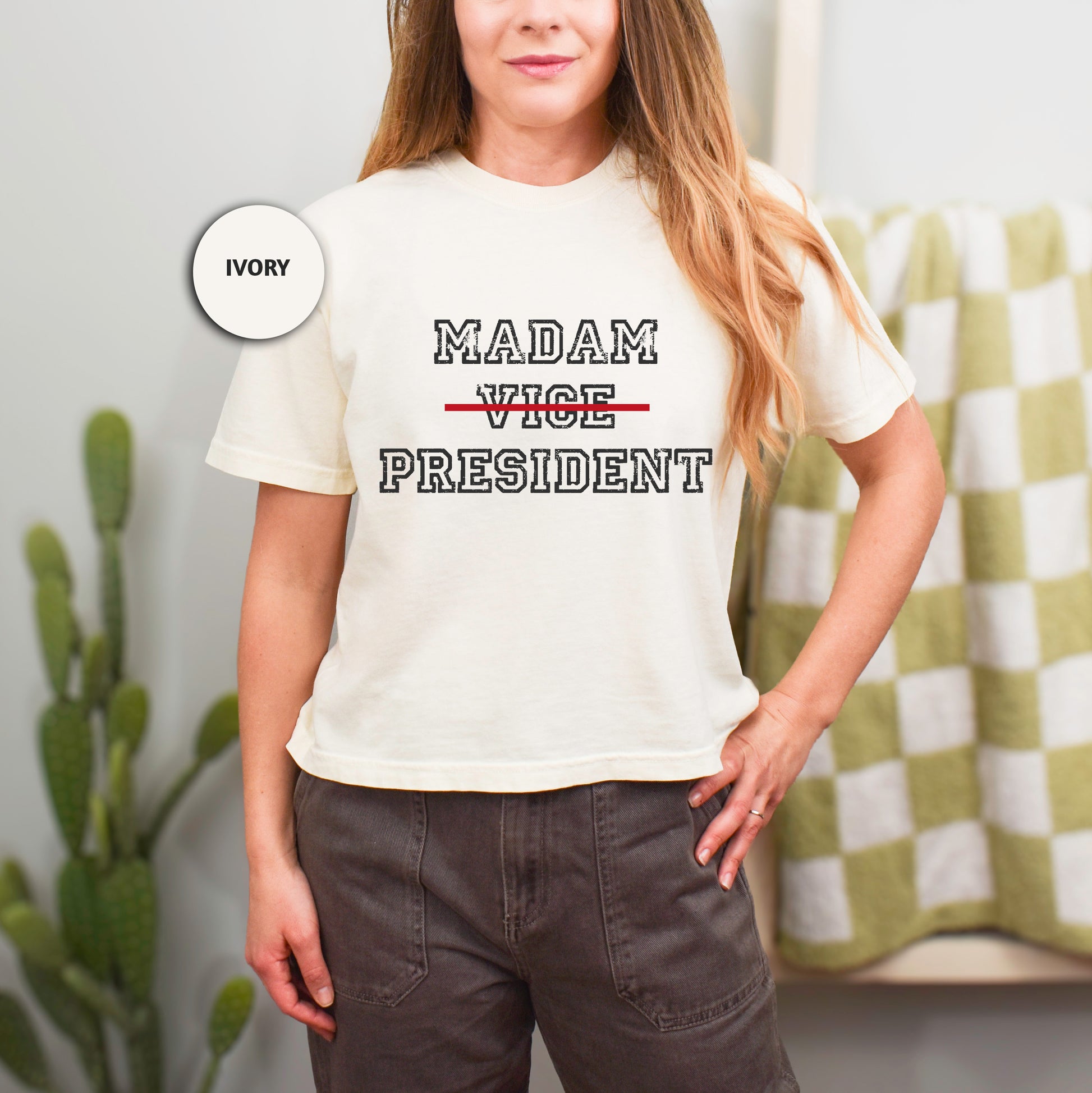 a woman wearing a tee shirt that says madam vice president