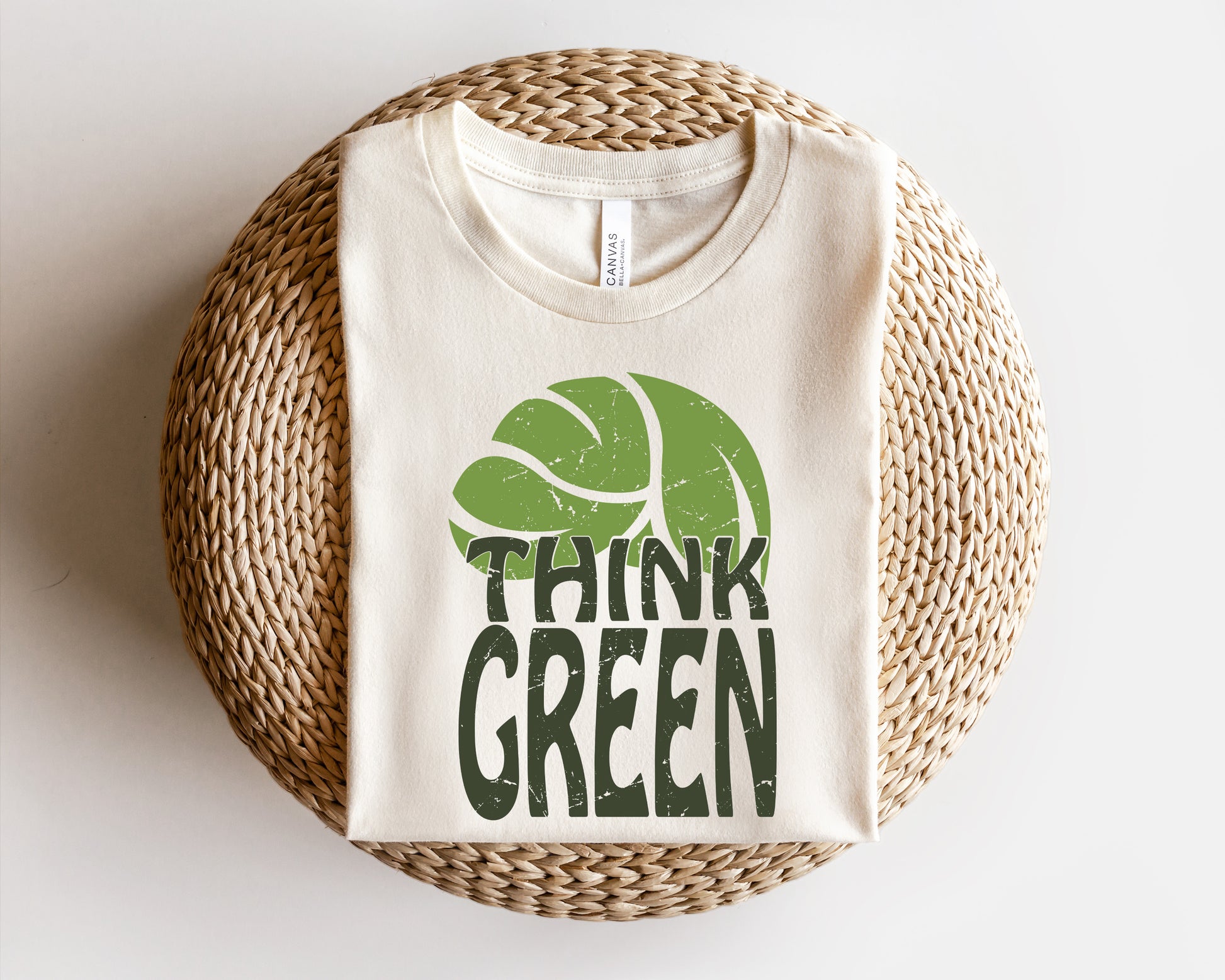 a t - shirt that says think green on it