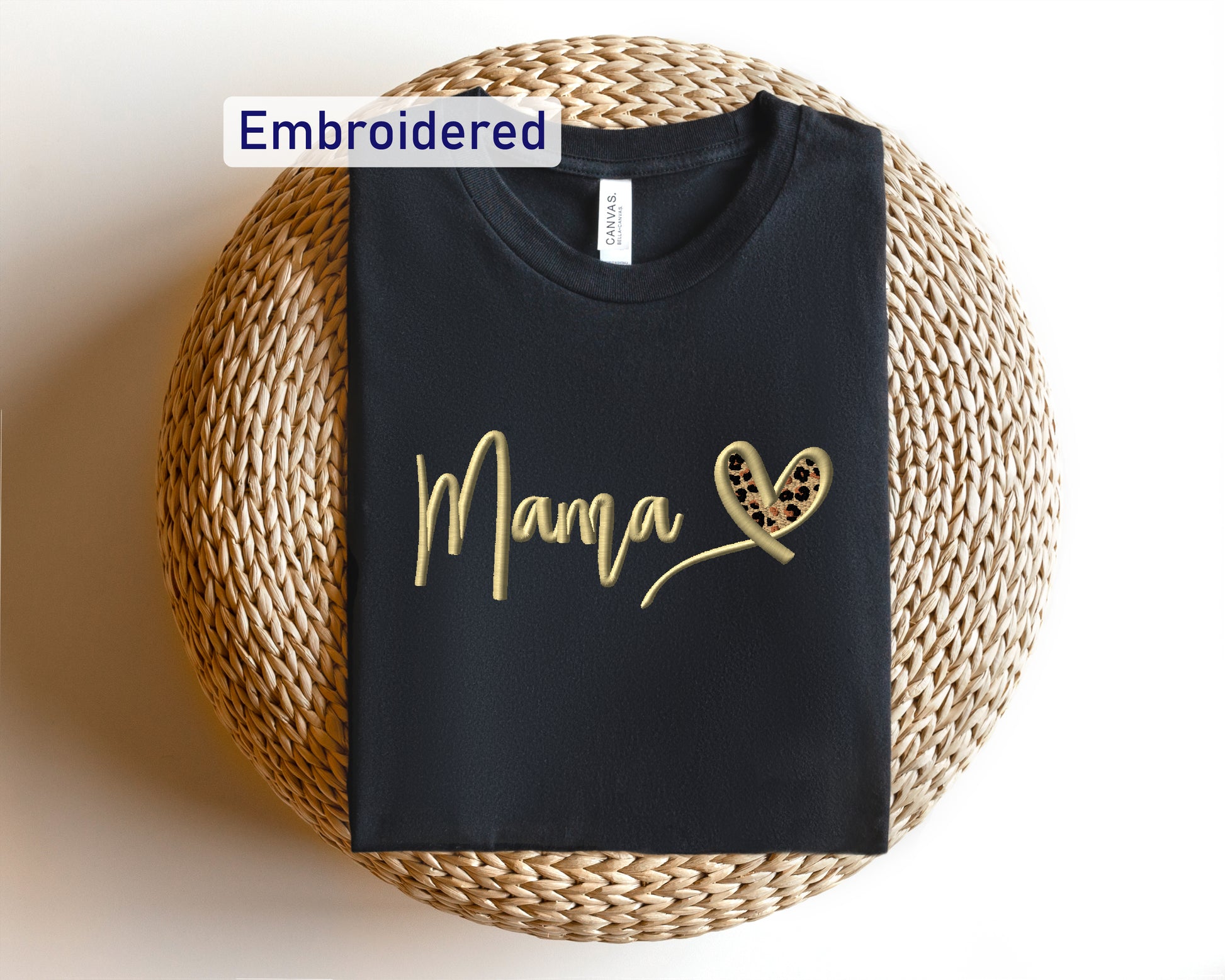 a black t - shirt with a gold heart and the word mama written on it