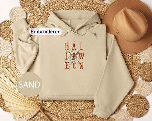 a white hoodie with the words hal low een printed on it