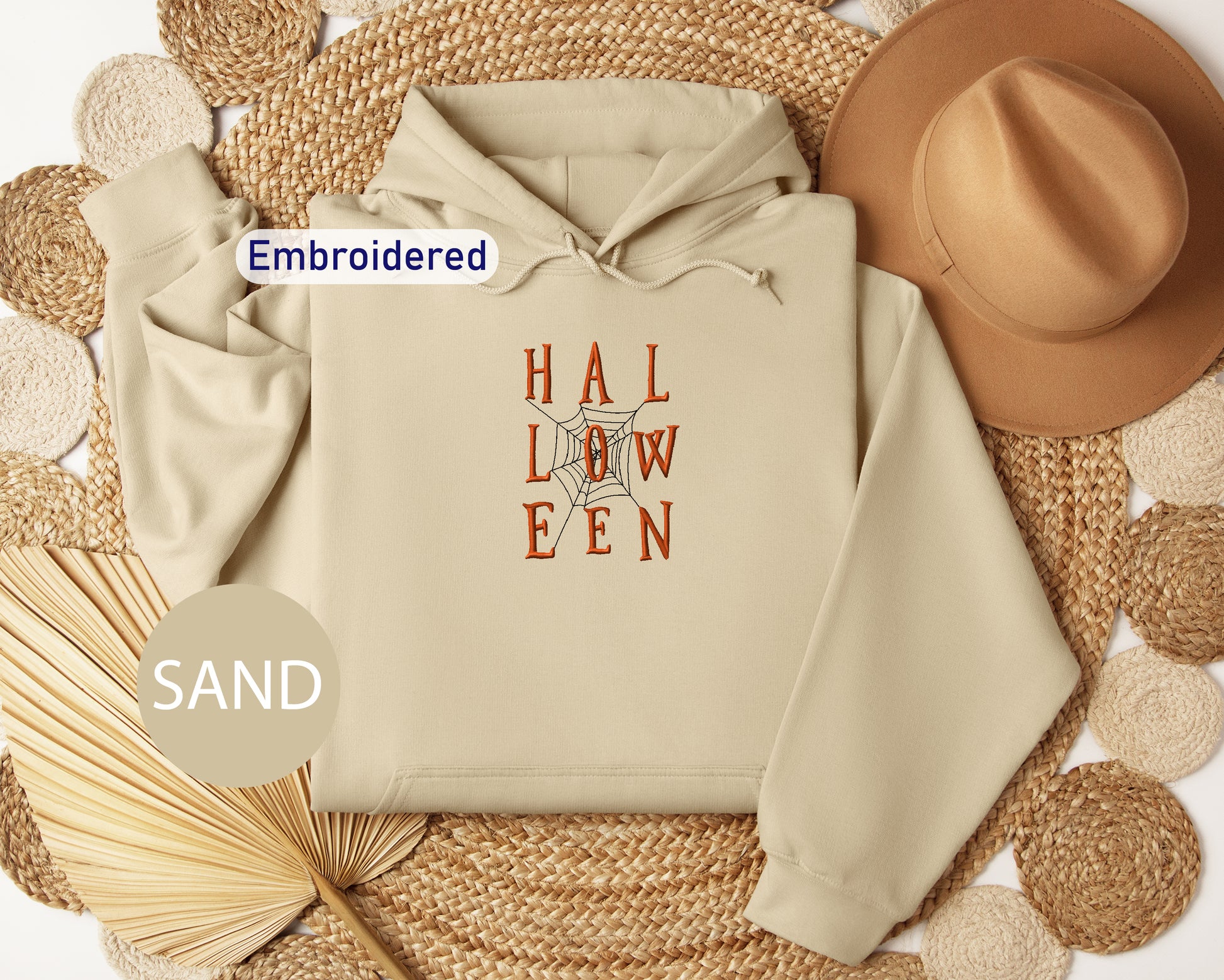 a white hoodie with the words hal low een printed on it