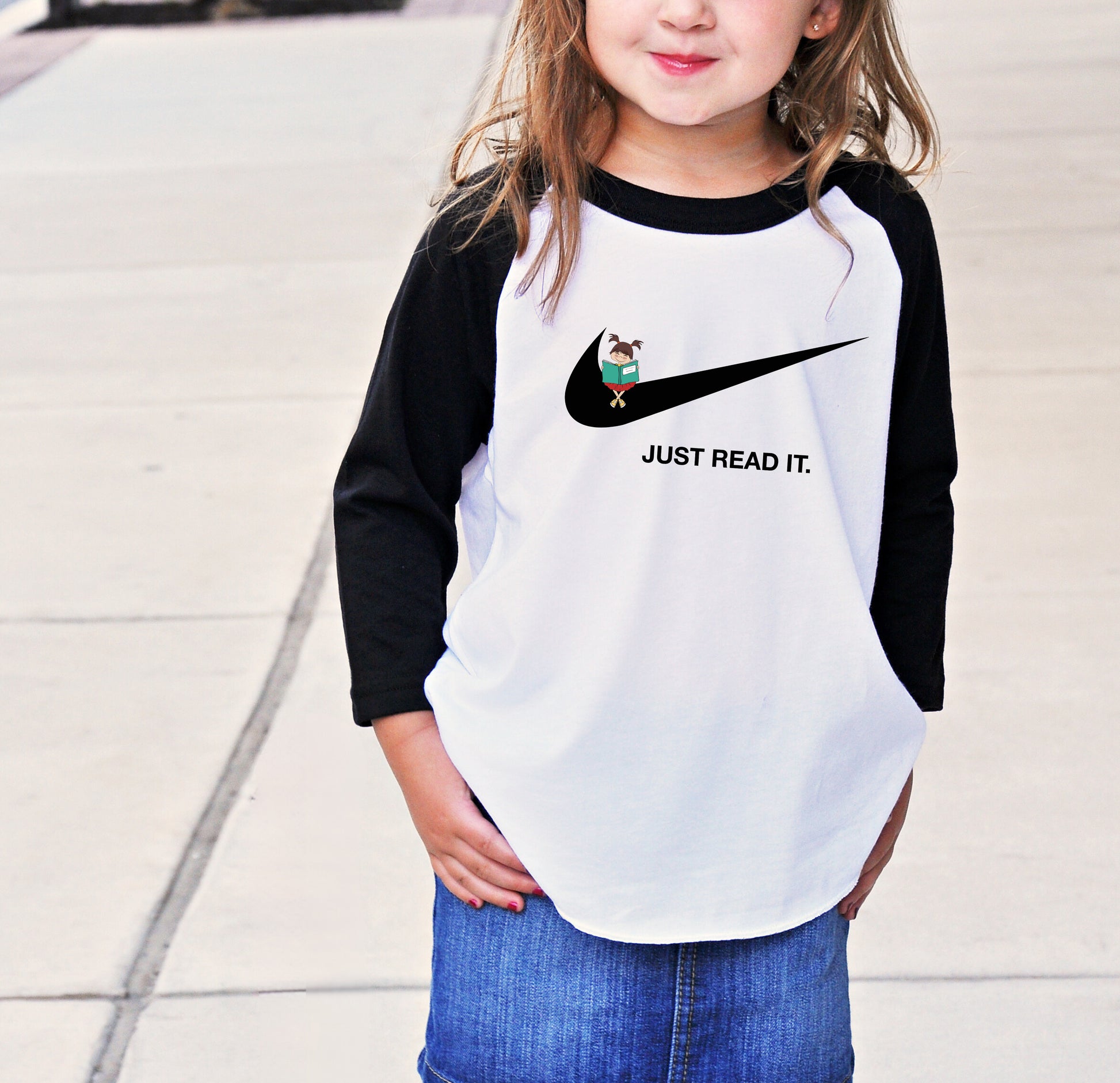 a little girl that is standing on a sidewalk