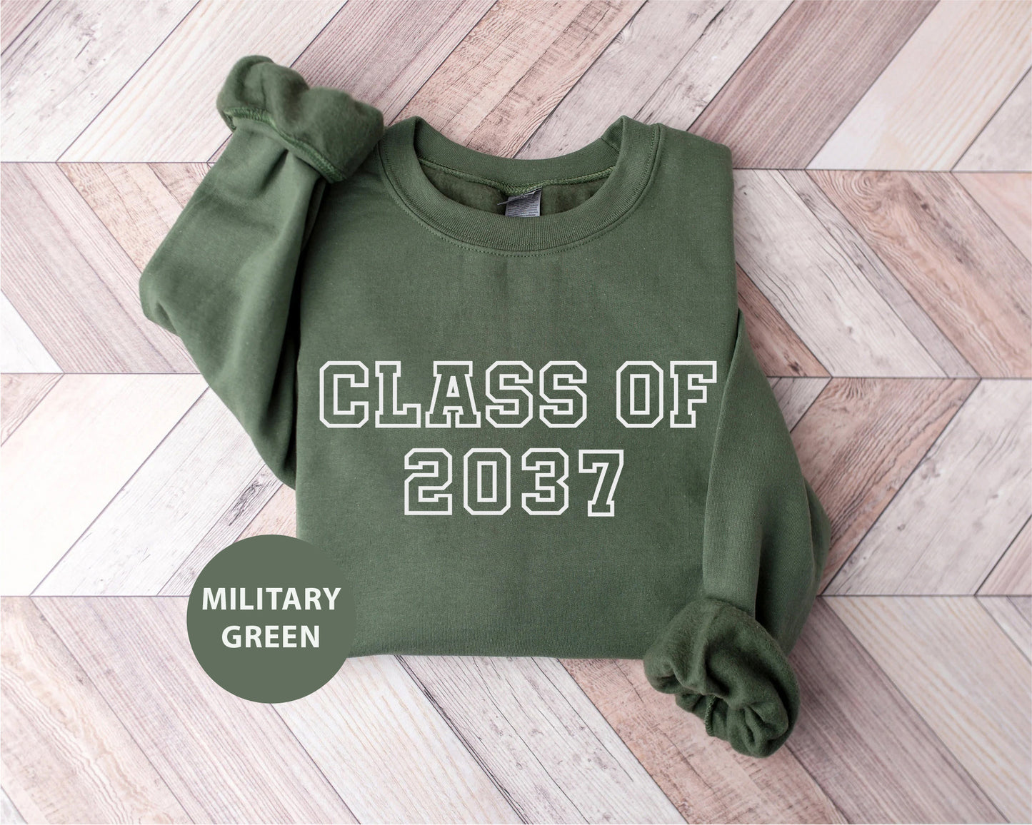 a green sweatshirt with the words class of 2077 printed on it