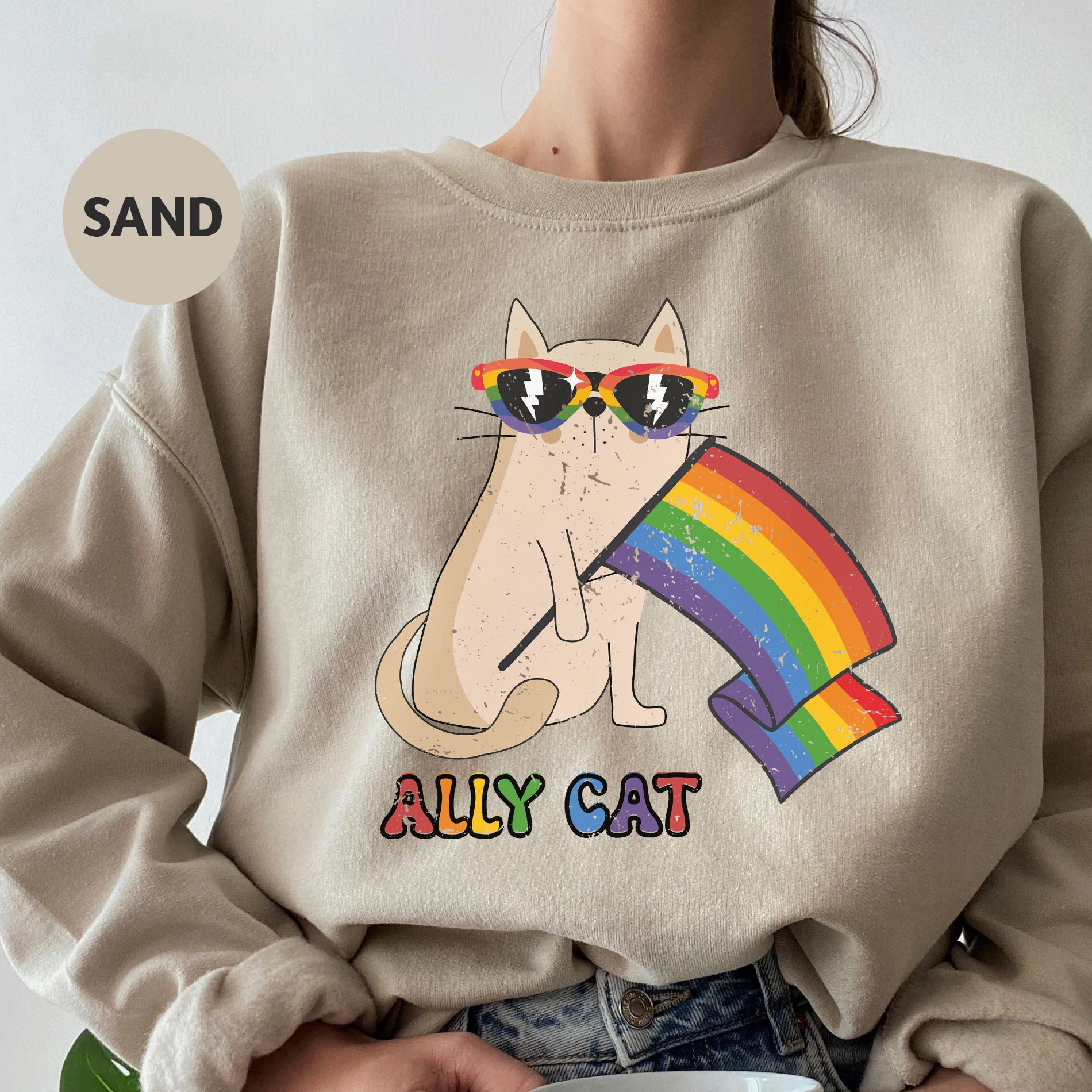 a woman wearing a sweatshirt with a cat on it