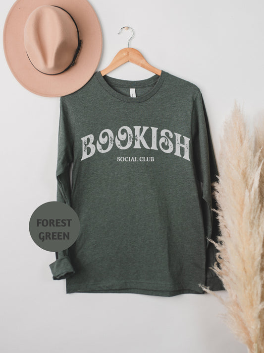 a hat and a t - shirt hanging on a wall