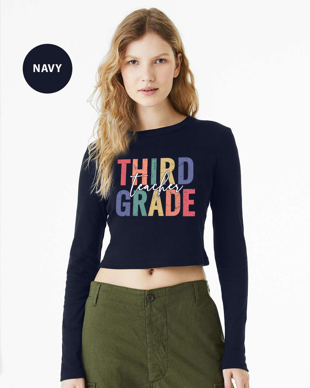 a woman wearing a crop top that says third grade