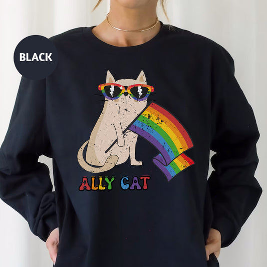 a woman wearing a black sweatshirt with an image of a cat wearing sunglasses