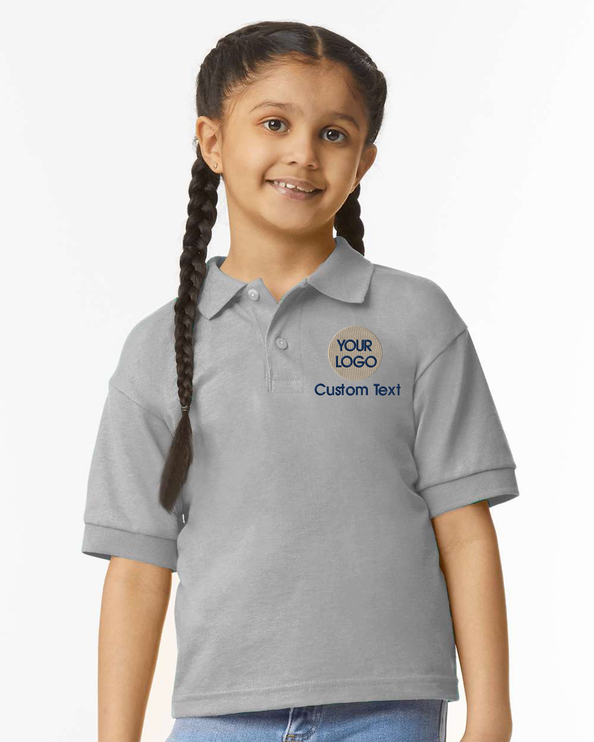 a young girl wearing a gray polo shirt