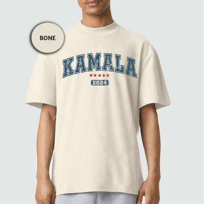 a man wearing a white shirt with the word kaamala printed on it