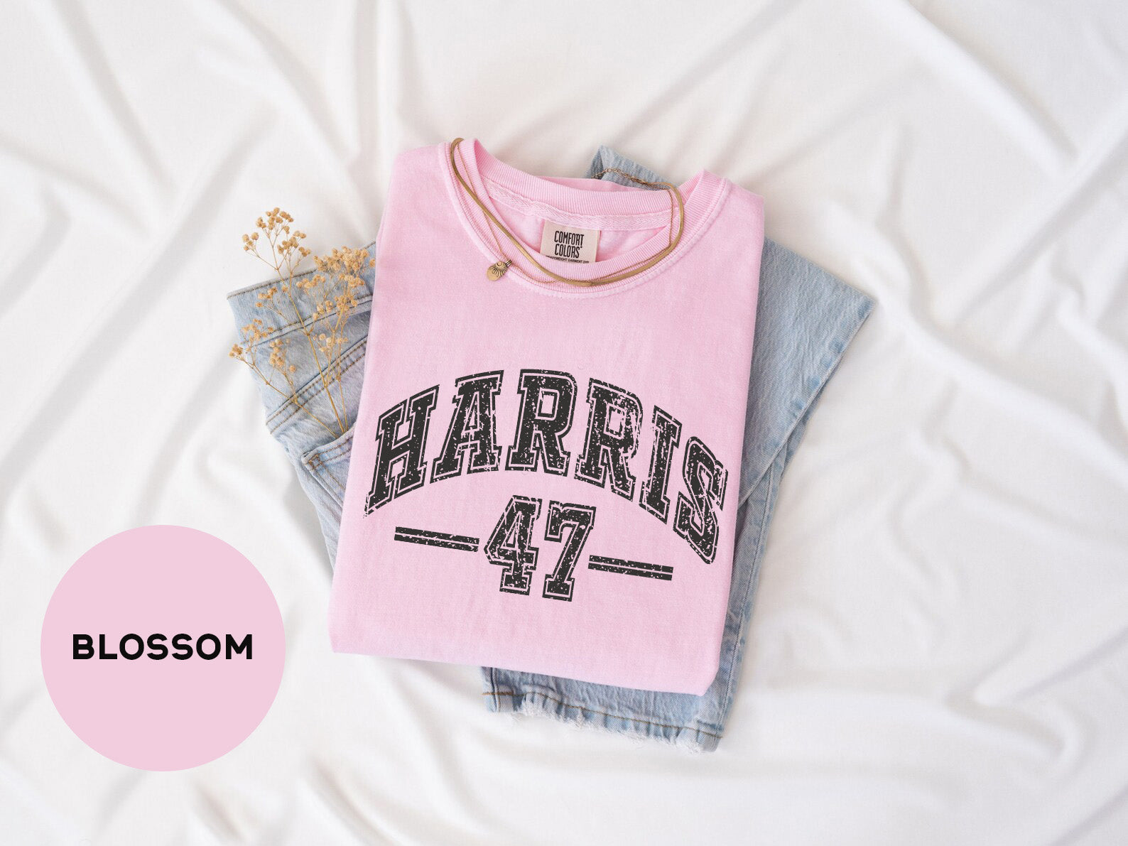 a pink shirt with the word harrison 47 printed on it