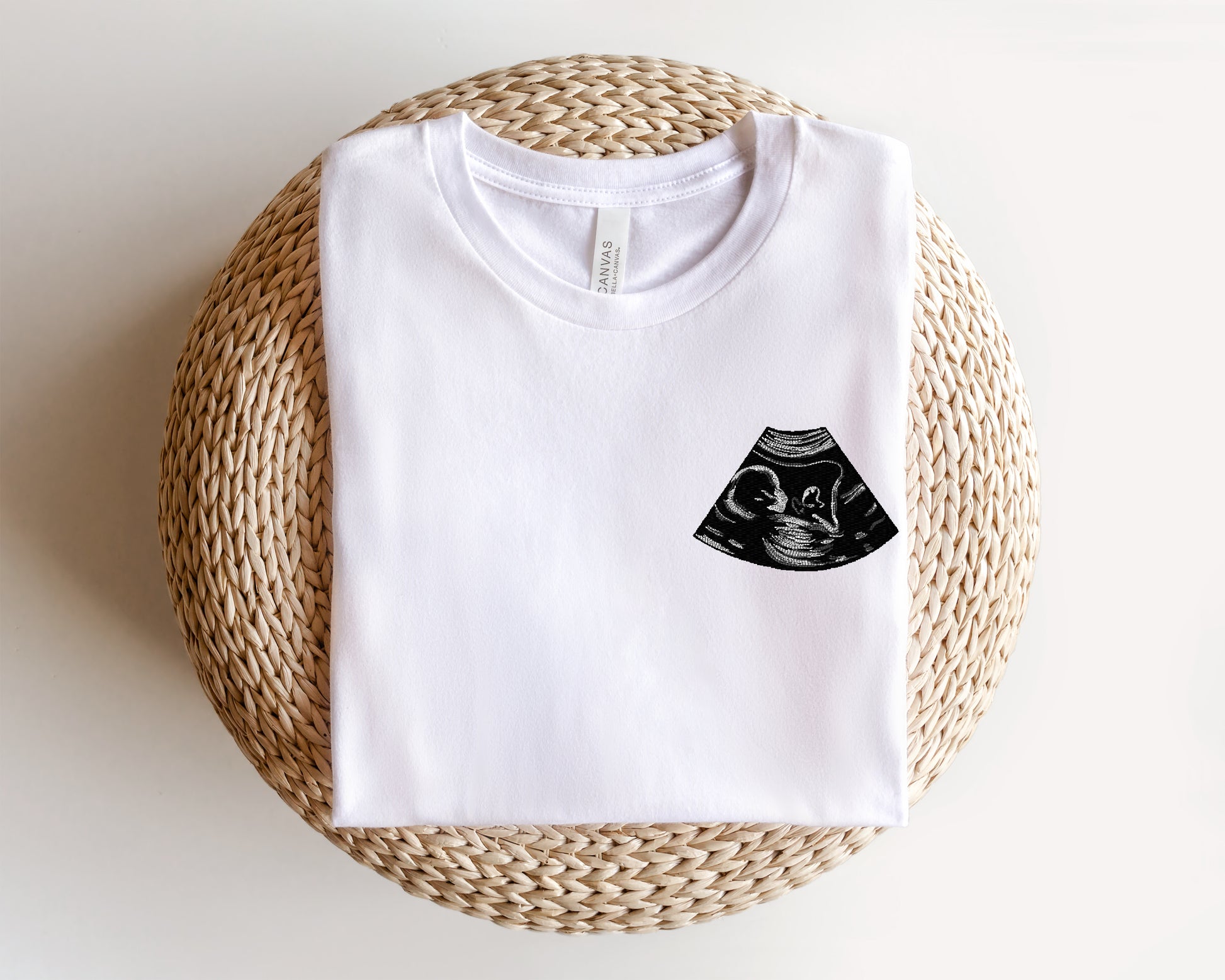 a white t - shirt with a black design on it