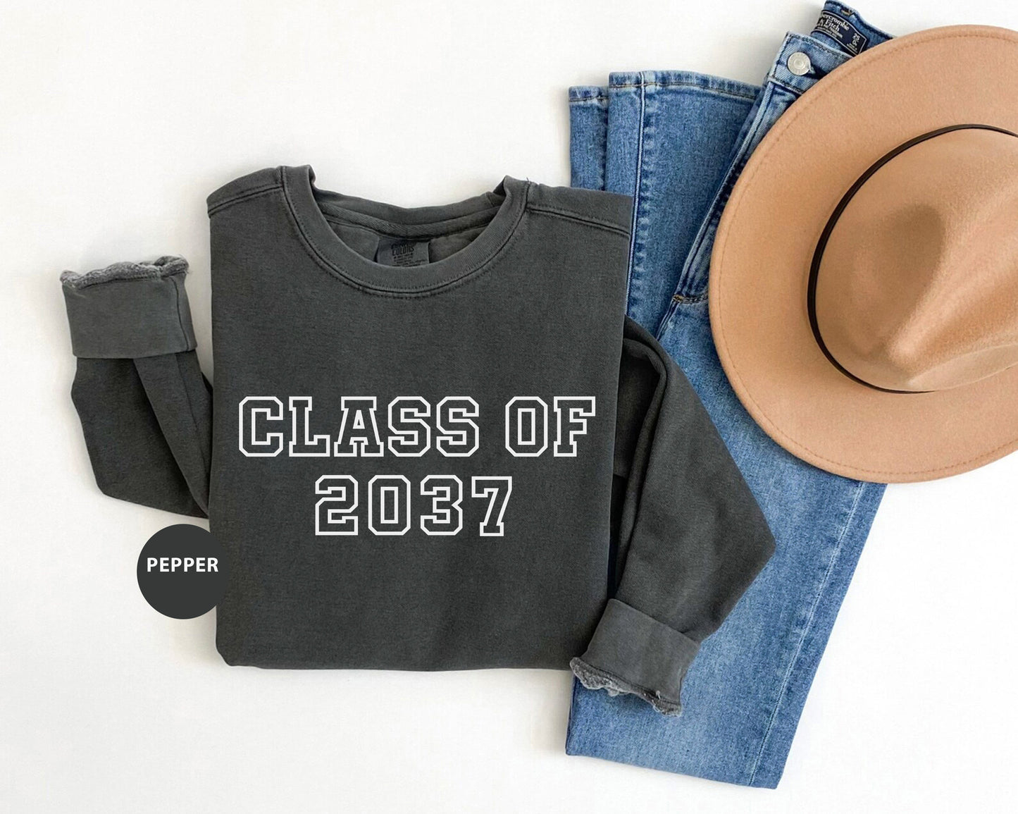 a pair of jeans, a hat, and a sweatshirt with the words class of