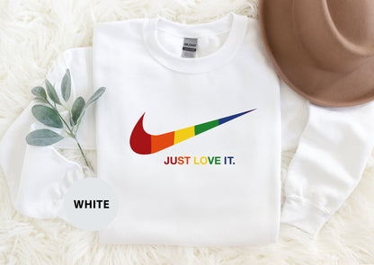 a white shirt with a rainbow nike logo on it