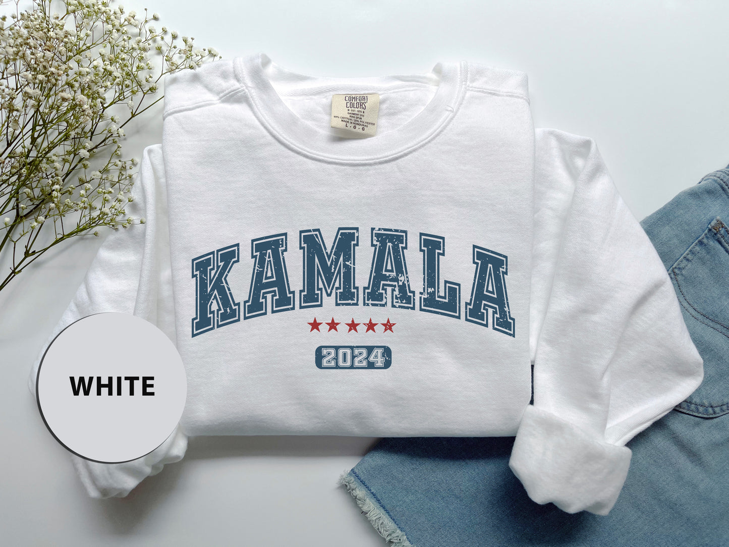 a white sweatshirt with the word kalamala printed on it