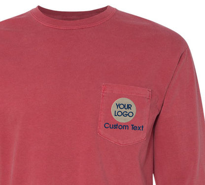 a red long sleeve shirt with a logo on the chest