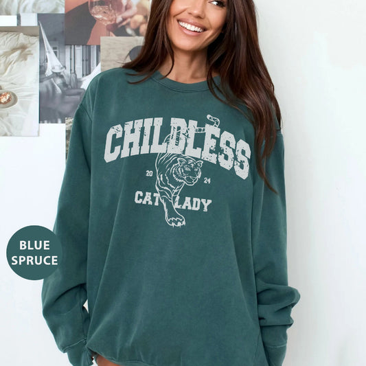 a woman wearing a green sweatshirt with a tiger on it