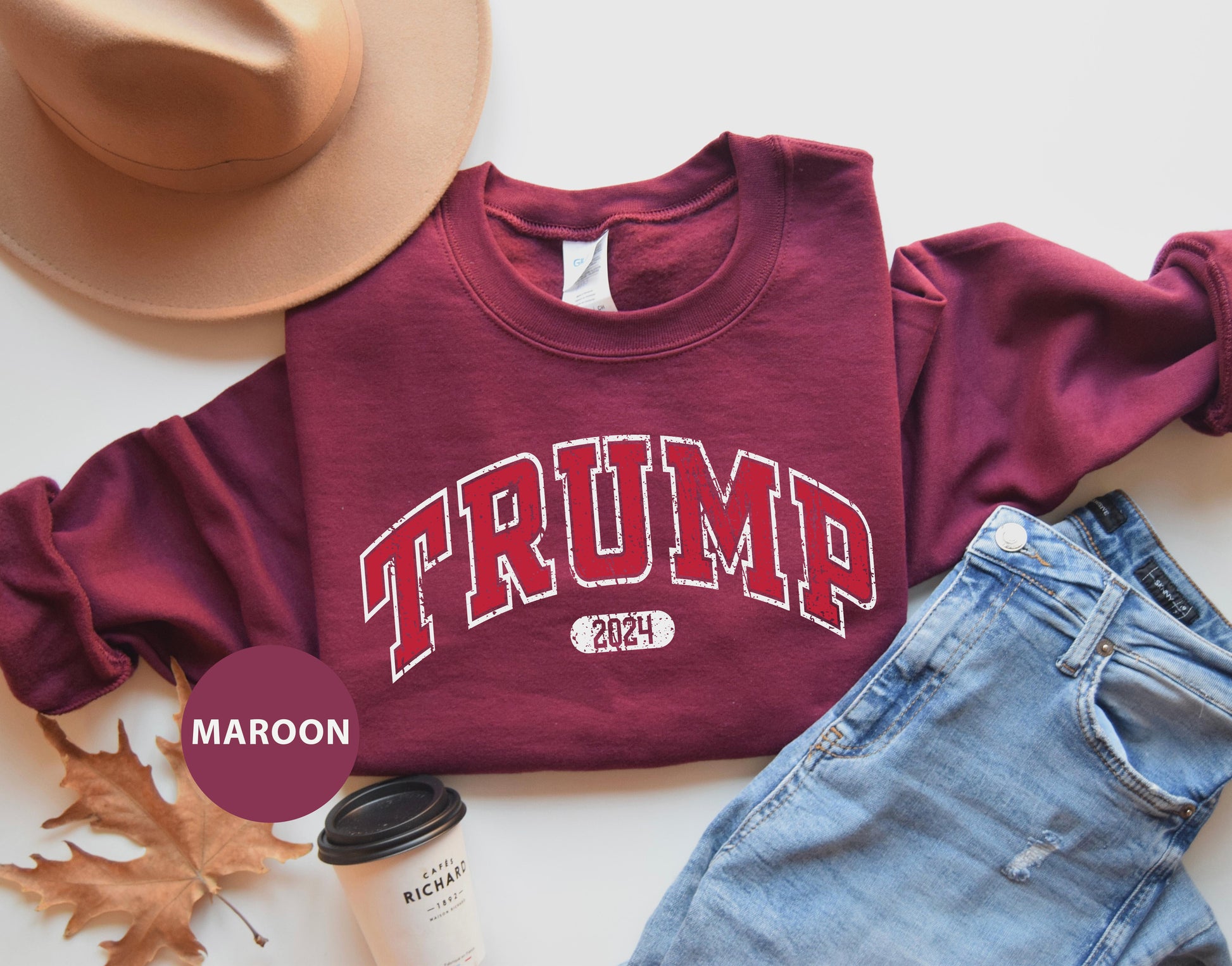 a maroon shirt with the word trump on it