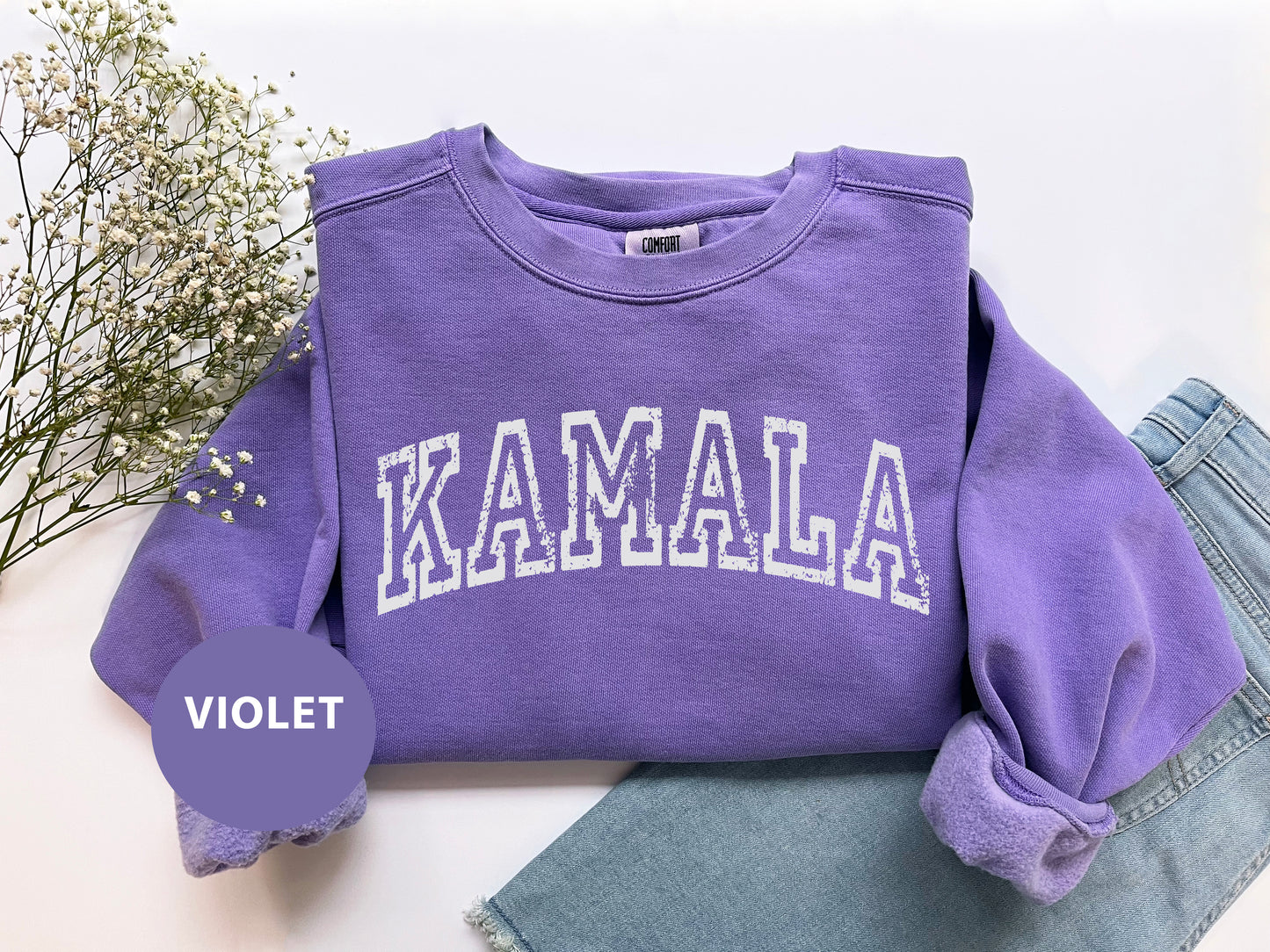 a purple sweatshirt with the word kalamala on it