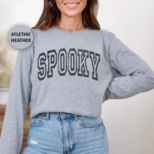 a woman wearing a sweatshirt that says spooky