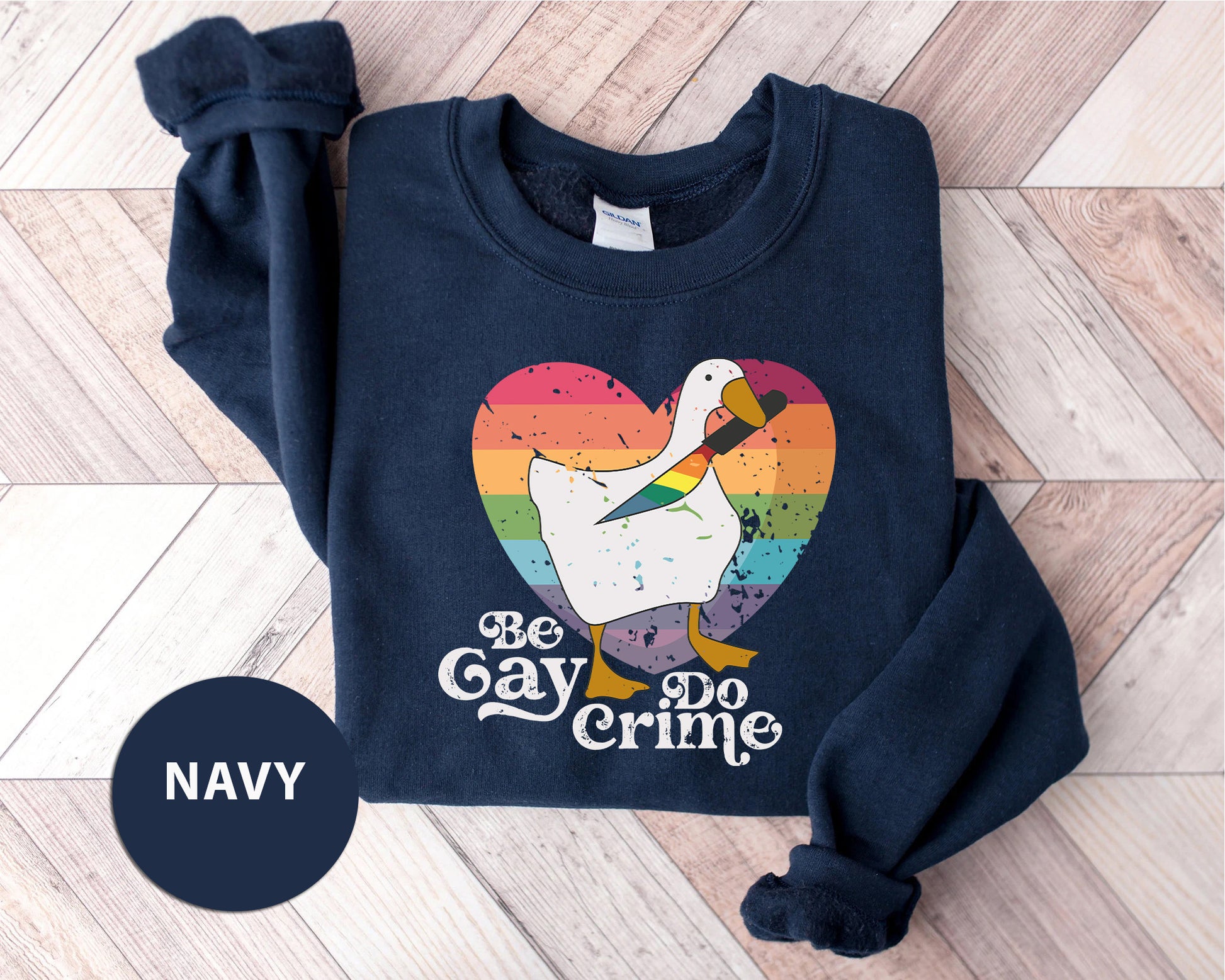 a navy sweatshirt with a white duck on it