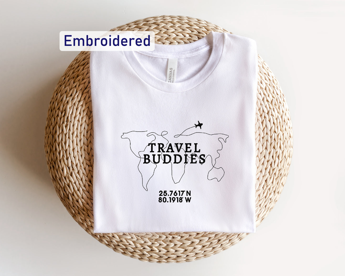 a white t - shirt with the words travel buddies printed on it