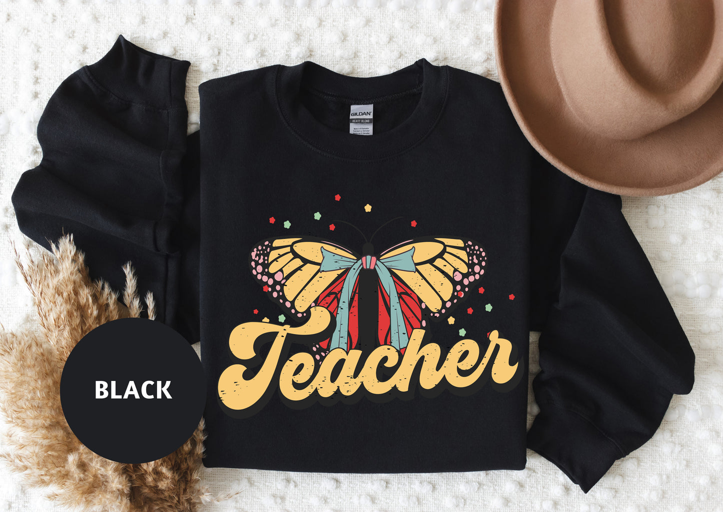 a black teacher shirt with a butterfly on it