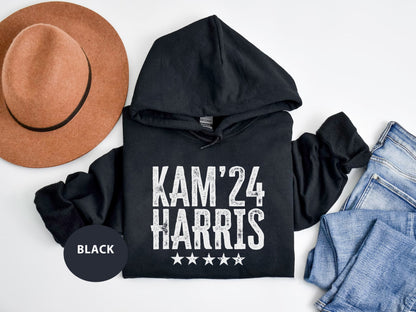 a black hoodie with a hat and jeans