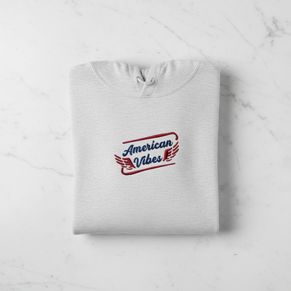 A white hoodie with a red and blue logo that says "American Vibes" on it.