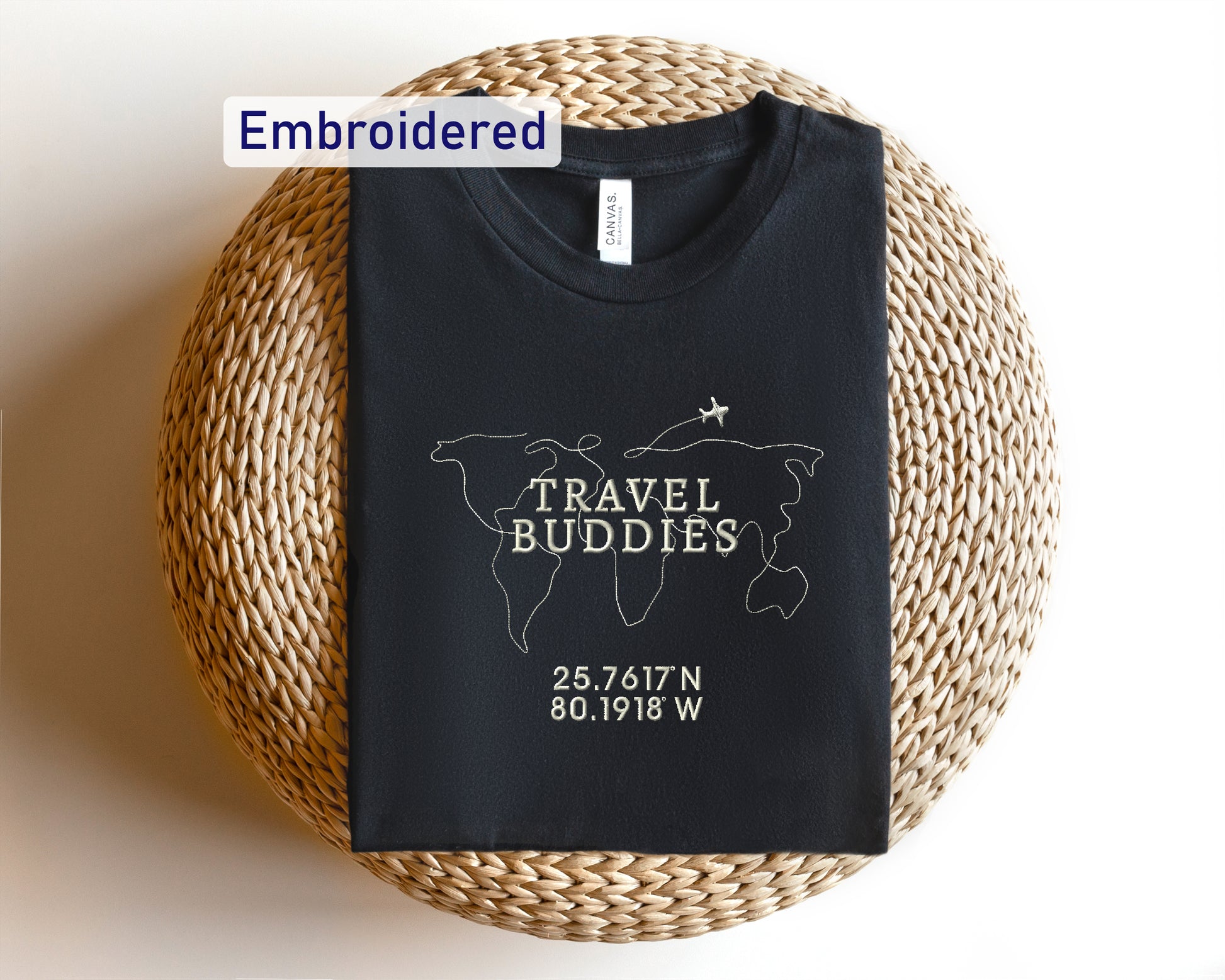 a black t - shirt with a travel buddies logo on it