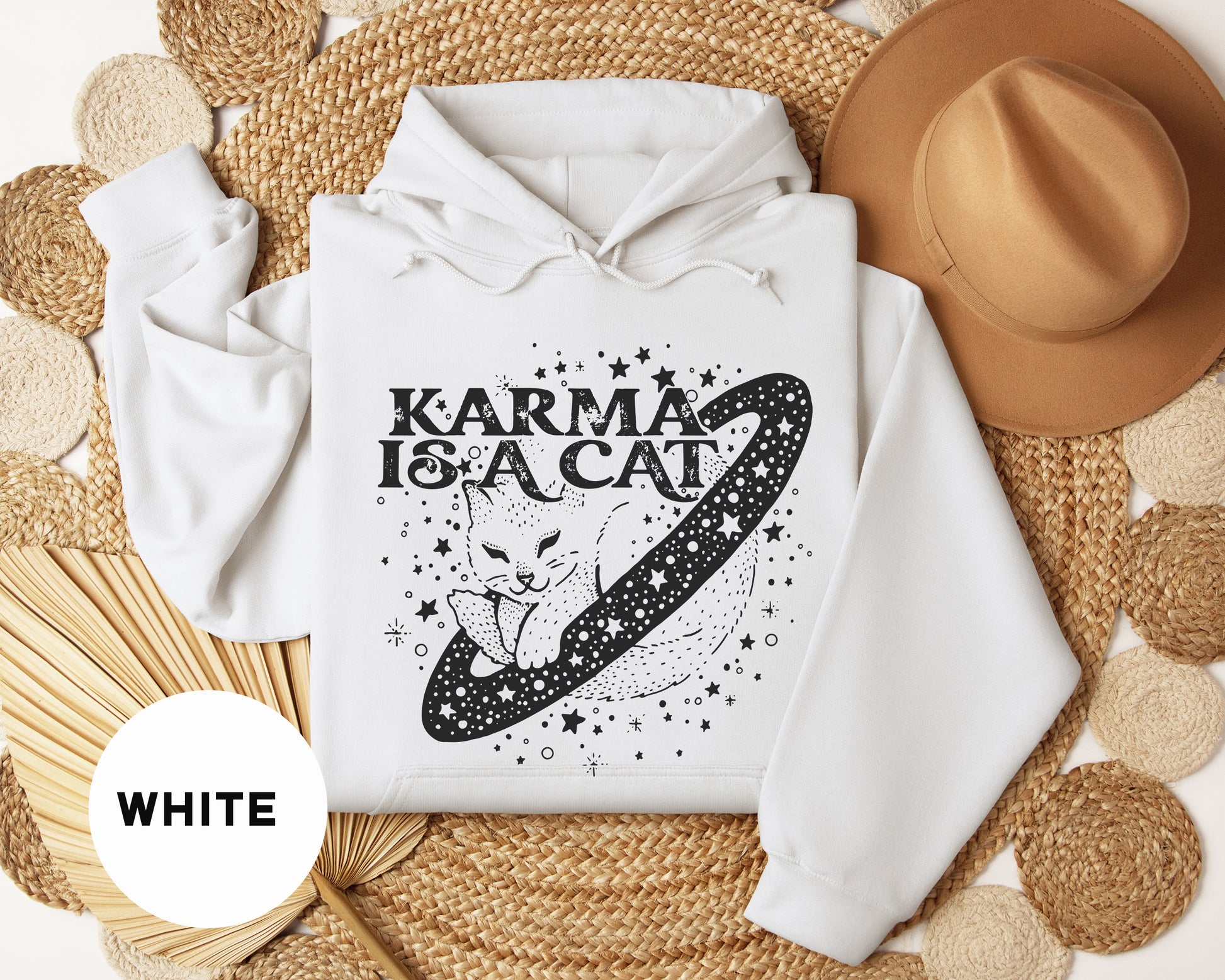 a white hoodie with a graphic of a cat on it