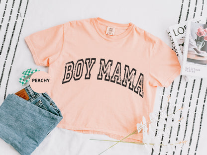 a shirt that says boy mama next to a pair of jeans