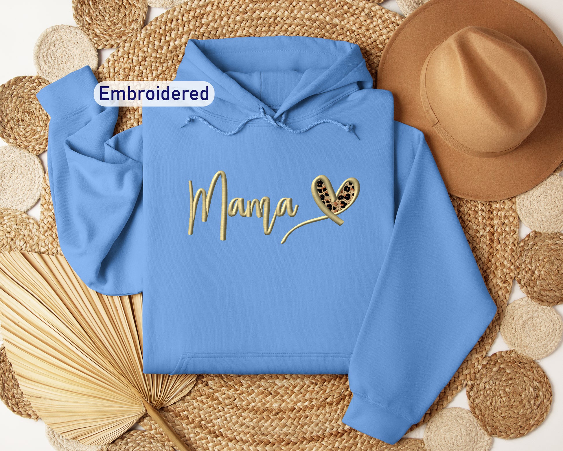 a blue hoodie with the word mama written on it