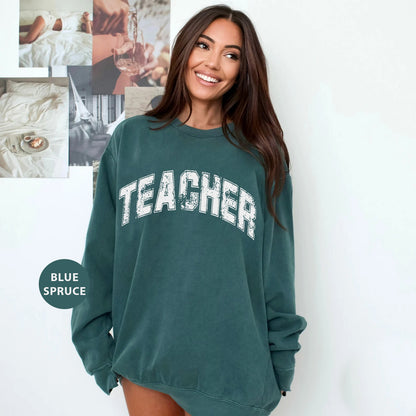 a woman in a green sweatshirt posing for a picture