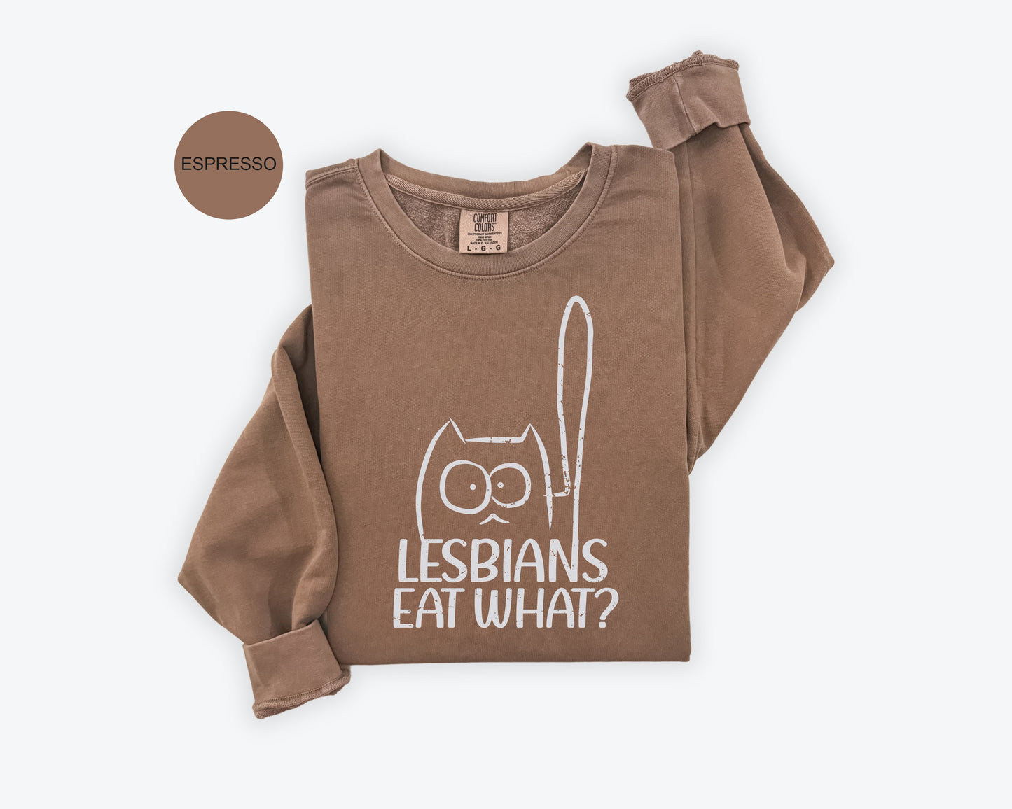 a brown shirt with the words lesbians eat what? on it