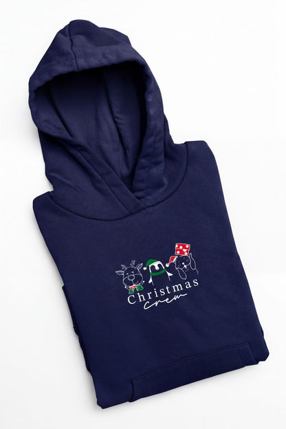 A navy blue hoodie with a white Christmas-themed design and text printed on it.