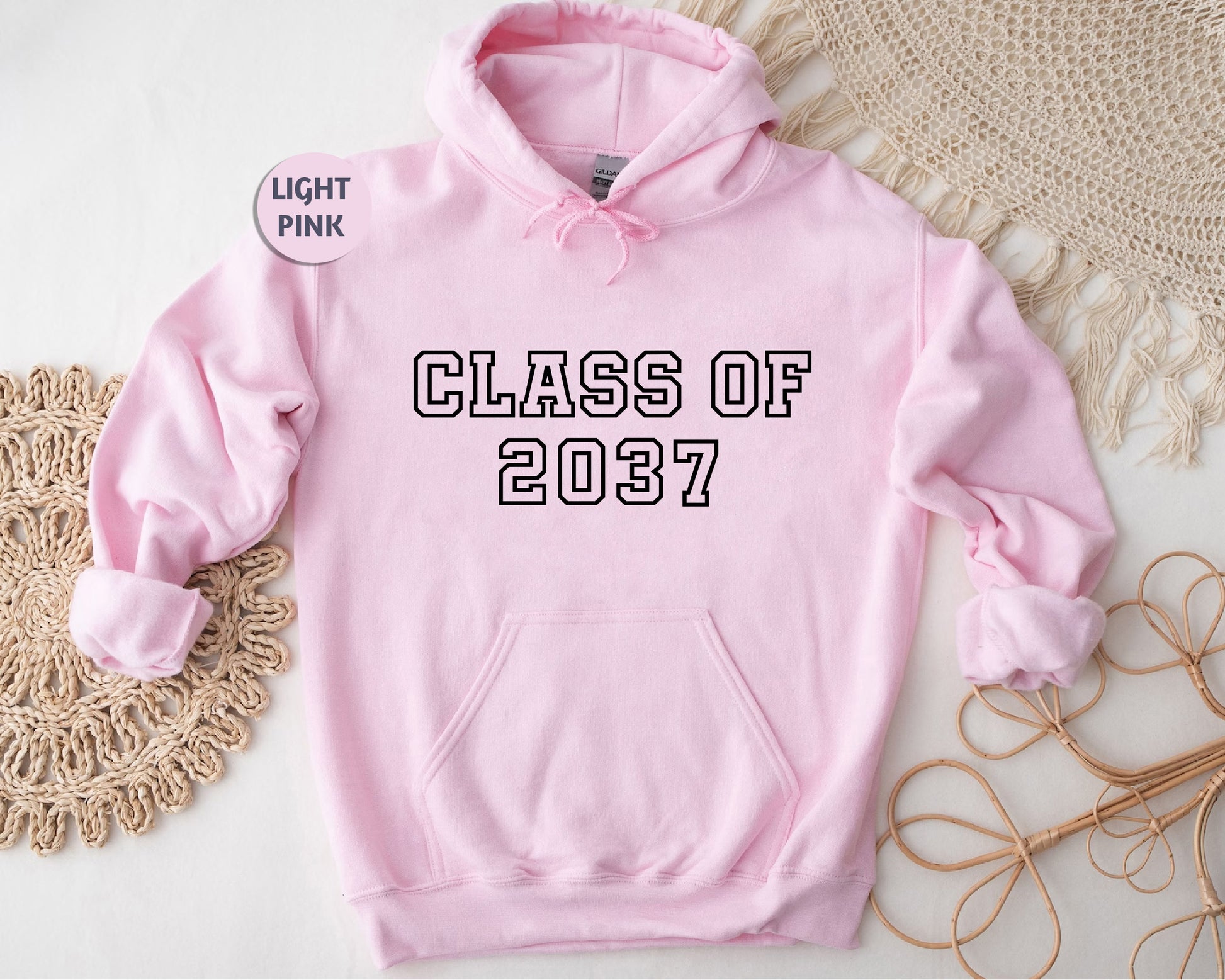 a pink hoodie with the class of 2021 printed on it