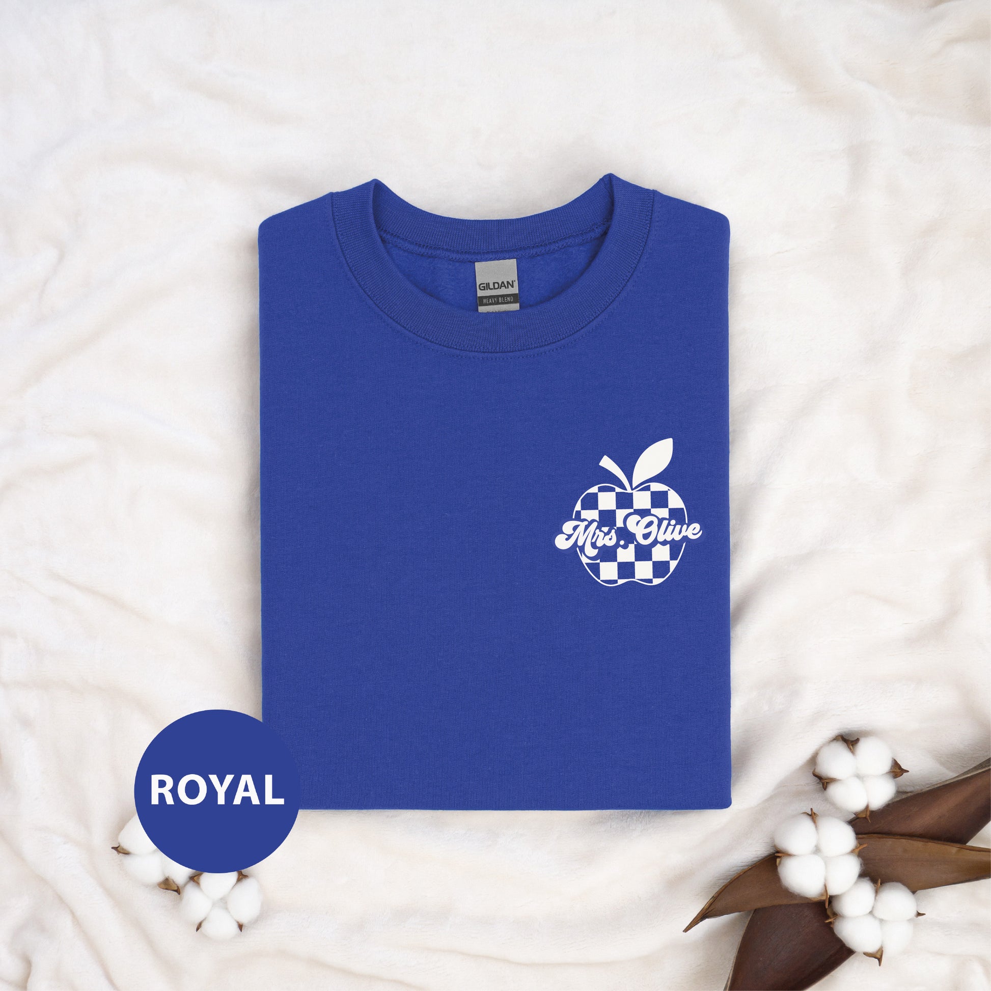 a royal blue shirt with an apple on it