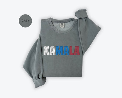 a gray sweatshirt with the word kaamala printed on it