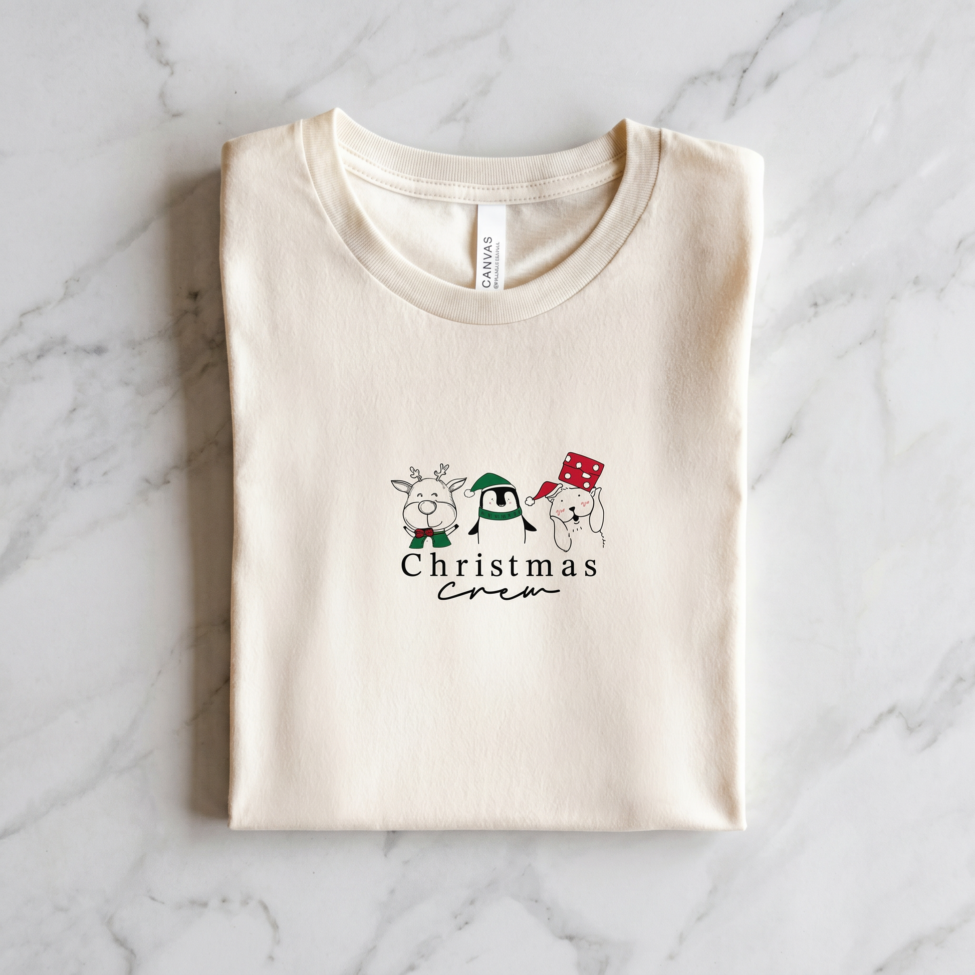 A white t-shirt with a graphic design featuring a cartoon character and the text "Christmas Crew" printed on it.