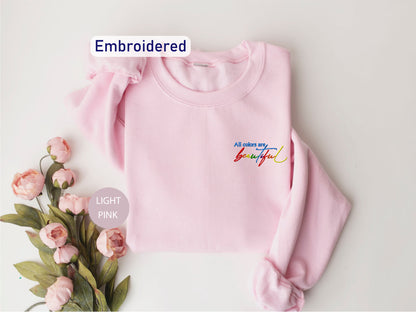 a pink sweater with the words embroidered on it