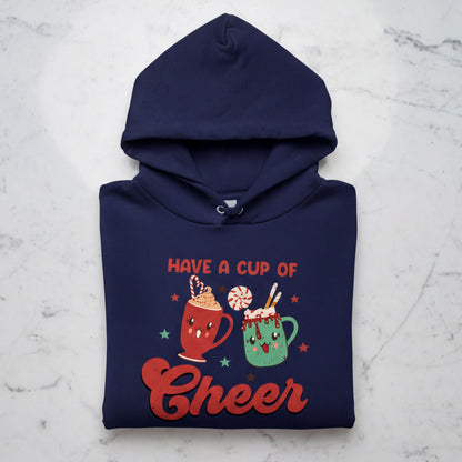 A navy blue hoodie with a graphic design featuring two colorful mugs and the text "Have a cup of cheer"