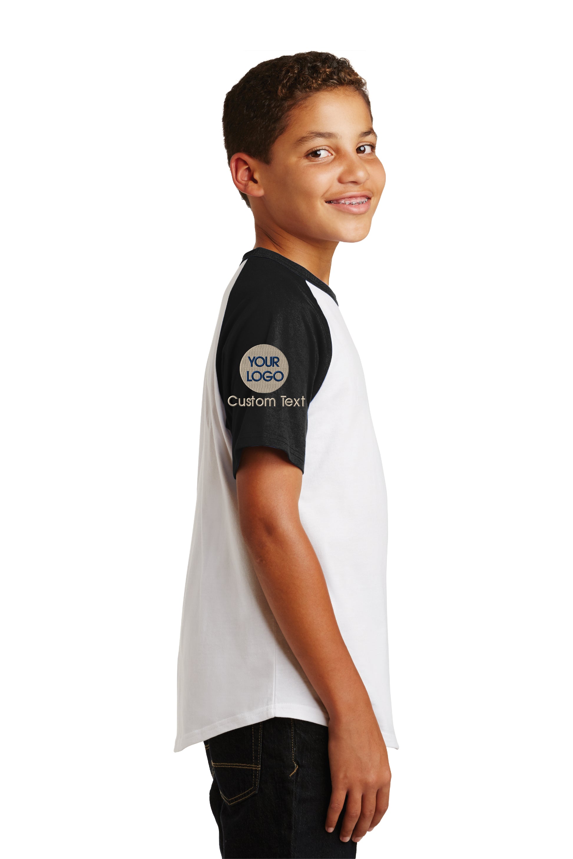 a young boy wearing a white and black shirt