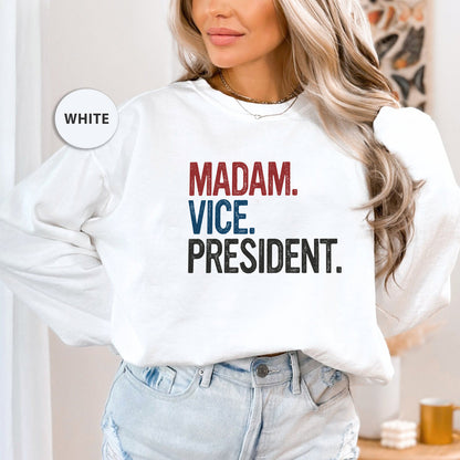 a woman wearing a sweatshirt that says madam vice president